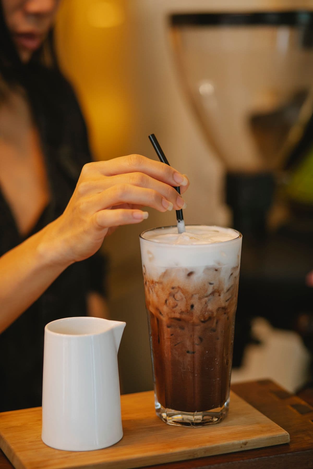 Serving a chilled drink to a guest at an event bar counter